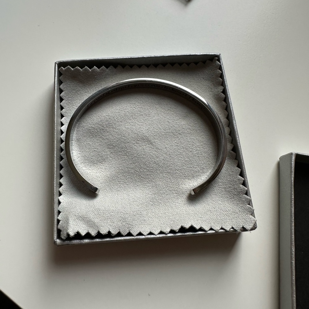 sliver bracelet with words in graved